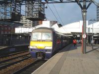 Northern Rail EMU 322483 stands at Leeds platform 11 east end on an extension to the allowed 6 minute turn around following early arrival on the 08.26 from Doncaster on 30 August.<br><br>[David Pesterfield 30/08/2013]