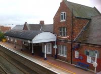 View over Hinckley station [see image 44275] from the footbridge in August 2013. There's quite a variety of architectural details on show. This platform is for trains towards Leicester.<br><br>[Ken Strachan 17/08/2013]