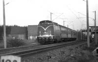 DB diesel hydraulic 220 058 heads west at Bruchmuhlen with a passenger service to Osnabruck in April 1976.<br><br>[John McIntyre /04/1976]