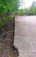 Part of the redundant west to south platform at Forres in May 2012. The southernmost section of the platform now borders the car park on the west side of the station. The Inverness - Aberdeen line runs across the top of the picture [see image 39013].<br><br>[John Furnevel 25/05/2012]