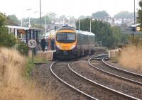 A TransPennine service from Manchester Airport to Edinburgh Waverley calls at Chorley on 7 September 2013. The forthcoming electrification of the Chat Moss route from Manchester to the WCML at Golborne Junction will result in these services being diverted that way from December.<br><br>[John McIntyre 07/09/2013]