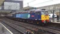 <I>The Settle and Carlisle Express</I> stands alongside a damp platform 3 at Carlisle on 11 September 2013. Locomotive in charge is DRS 47805 <I>John Scott</I>.<br><br>[Bruce McCartney 11/09/2013]