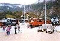 Scene at Flam terminus on 26 June 1994. An NSB class 69 EMU awaits departure with the next service to Myrdal, flanked by a pair of X10 units, borrowed for use during the summer peak. The X10s were popular with tourists due to their larger windows. The SL (Stockholm Commuter Rail) unit on the right was being used for driver training.<br><br>[John Furnevel 26/06/1994]