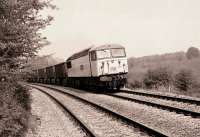 56034 westbound with stone empties from the London area passing the site of the Crofton Pumping Station on 3 May 1990.<br><br>[Peter Todd 03/05/1990]