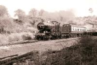 Veteran ex-GWR 4-4-0 no 3440 <I>City of Truro</I> exiting Greet Tunnel on the Gloucestershire Warwickshire Railway on  14 October 1990 with a train for Winchcombe.<br><br>[Peter Todd 14/10/1990]