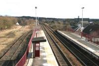 View east towards Shotts from the footbridge at Cleland in March 2006. Originally opened as Bellside in 1869, the station carried the name Omoa between 1879 and 1941, before adopting its current title. Signs of the various railways, works and mines that once dominated this area of industrial Lanarkshire are gradually fading. [See image 28204] <br><br>[John Furnevel 20/03/2006]