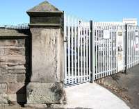 The significant surviving <I>gatepost</I> on what was the access road running east off the A 1167 Northumberland Road to Tweedmouth station, photographed in October 2012. The station closed to passengers in June 1964 and the site now hosts a number of commercial premises, including a large building supplies operation. ECML catenary is just visible top left.<br><br>[John Furnevel 07/10/2012]