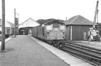 Birmingham Type 2 26023 waits at Thurso on 23rd September 1976 with the teatime departure (about 17.25) for Georgemas Junction, where the coaches will be attached to the Wick - Inverness service (powered on this day by 26046). <br><br>[Bill Jamieson 23/09/1976]