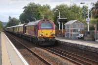 67019on an Edinburgh - Leuchars charter passing through Rosyth station on 16 September 2013. 67006<I>Royal Sovereign</I>is on the rear of the train.<br><br>[Bill Roberton 16/09/2013]