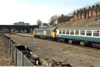 50029 <I>Renown</I> approaching Exeter Central with a train from London in 1984. Through the bridge a classmate is preparing to leave the platform on the reverse journey.<br><br>[Ian Dinmore 31/03/1984]