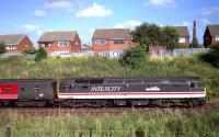 Sporting InterCity livery and with the <I>Porterbrook</I> nameplate on the side, 47810 hauls a Virgin service south from Preston in September 1999, seen here passing Farington.<br><br>[John McIntyre /09/1999]