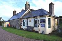 Loth Station was on the section of the Duke of Sutherland's Railway that was opened on 1st November 1870 as far as Helmsdale. The station closed to passengers on the 13th of June 1960. The original station is the stone building on the left,this is now a private residence. The wooden extension was added in 1930 and is now a shop selling antiques and collectables including old railway items. Many of the original fittings are still in place.<br><br>[John Gray 17/09/2013]