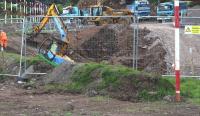 The west side of Winston Road, Galashiels on 18 September 2013 looking in the direction of the planned Galashiels station. Work is underway here on re-excavation of the filled-in bridge and cutting via which the Waverley route once passed below the camera under Winston road. [See image 42351]<br><br>[John Furnevel 18/09/2013]