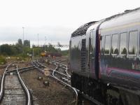 43170 leads the 15.29 departure from Swindon to Paddington, ex Swansea, on 19 September. Standing up ahead is 66027 stabled with a rake of loaded steel wagons brought out of Cooper's scrapyard during the morning.<br><br>[David Pesterfield 19/09/2013]