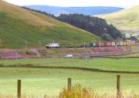 A class 90 locomotive hauls a container train north between Crawford and Abington in the summer of 2006.<br><br>[John Furnevel 10/08/2006]