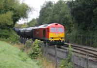 Newly shopped DBS 60062 waits for clearance at Strand Rd to proceed along the Ribble Branch and up to the main line with the empties from Preston Lanfina. The Class 60 has just delivered the full tanks in the siding on the left.<br><br>[Mark Bartlett 23/09/2013]