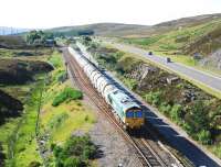 A southbound empty cement train passing Slochd Summit on 22 July 2010 behind Freighliner 66609 on its way back to Oxwellmains.<br><br>[Ewan Crawford 22/07/2010]