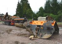 After being derailed by a landslide at the end of June 2012 [see image 39479] Class 66 No.66734 <I>The Eco Express</I> has been dismantled in situ and the parts recovered to the yard at Tulloch Station for disposal. In the picture are the buffer beams, fuel tank and diesel engine.<br><br>[John Gray 23/09/2013]