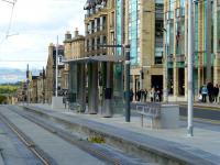 The tram stop in St Andrew Square on 17 September 2013. View is north towards the Firth of Forth with the hills of Fife visible in the background.<br><br>[Colin Miller 17/09/2013]