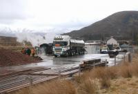 Thirsty? A water tanker meets Black 5 44871 with <I>Great Britain VI</I> at Achnasheen station on 26 April 2013.<br><br>[Ewan Crawford 26/04/2013]