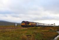 67009 heads north over Corrour Summit with the Caledonian Sleeper on 23 September, destination Fort William.<br><br>[John Gray 23/09/2013]