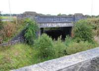 View south at Salsburgh Goods in September 2013. This section of the line looking back towards Cleland [see image 28204] closed in 1956. A mineral line and siding ran under the bridge from which the photograph was taken to reach a yard with road access and a crane (now infilled and part of a farm). From there a single line continued on to serve various quarries and collieries. The line north closed in the 1940s. The bridge in the centre carries the B7066 between Newhouse and Harthill. <br><br>[John Furnevel 23/09/2013]