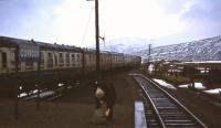 In December 1974 the northbound sleeper reached Corrour at daybreak. It had been dark for a while by the time the train home arrived in the evening but the signalwoman had a coal fire going to keep walkers warm before flagging down the train with her Tilley lamp.<br><br>[John Robin 14/12/1974]