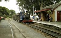 Isle of Man Railway locomotive No 12 waits at the platform of Ballasalla station in July 1996 with a Douglas to Port Erin train, waiting for a northbound service to pass.<br><br>[John McIntyre /07/1996]