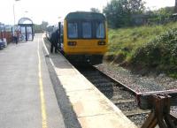 Northern DMU 142031 awaits its departure time at Blackpool South terminus on 24 September 2013 with the 13.44 service to Colne.<br><br>[Veronica Clibbery 24/09/2013]