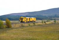 A Network Rail <I>stoneblower</I> crossing the moors at Moy on 29 September 2013 on its way to Inverness.<br><br>[John Gray 29/09/2013]