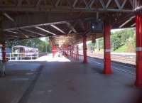 Light and shade looking North at Lancaster on 29th July. The train in platform 1 is the 16.55 to Millom - which station apparently has the highest traffic of any station in the UK, relative to the surrounding population. This anomaly is explained by the proximity of the BNFL plant at Sellafield.<br><br>[Ken Strachan 29/07/2013]