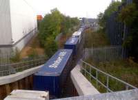 After two and a half years [see image 33772], I finally photograph a train passing under the A5. The train headed South out of the yard about ten minutes after this shot was taken on 27 September 2013.<br><br>[Ken Strachan 27/09/2013]