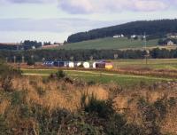 66097 hurries south at the head of 4D31, the 10.27 Elgin-Grangemouth whisky service, south of Cairnie Junction on 14thSeptember 2013. This was the inaugural train of the EU-funded<I>Lifting the Spirit</I> project.<br><br>[David Spaven 14/09/2013]