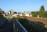 The 1600 to Sheringham photographed alongside Wroxham signal box on 30 September.<br><br>[Bruce McCartney 30/09/2013]