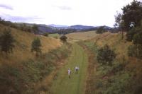 The section of the Waverley Route between Hawick and Hassendean is still eminently walkable and indeed capable of reinstatement as a railway. Looking back south towards Hawick on 9th August 2013.<br><br>[David Spaven 09/08/2013]