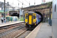 The 12.27 Edinburgh Waverley - Glasgow Central emerges from Haymarket Tunnel and runs into platform 4 at the east end of Haymarket station on 9 August.<br><br>[John Furnevel 09/08/2013]