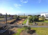 View from the end of the track towards the pier in May 2013, with the line now landscaped. The whole area at the riverside of the Yarra where the pier and freight sidings were is security-fenced as it is a naval base where the RAN's carrier <I>HMAS Canberra</I> is at present fitting out. You would never know there had been a railway there. [See image 26322]<br>
<br><br>[Colin Miller 21/05/2013]