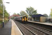 The station buildings have gone at Stocksfield but the waiting shelters are traditional as well as substantially built and the distinctive footbridge is in good order. 156475 passes through without stopping on a Newcastle to Carlisle semi-fast service on 4th October 2013. <br><br>[Mark Bartlett 04/10/2013]