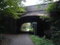 View South of London Road skew overbridge, Balderton, Newark, on the former route running from the East Coast line at Newark to the north side of Melton Mowbray thro' the former ironstone area of the country, with connections to the Grantham to Nottingham line. The presence of the stream running through the arch on the right hand side suggests the line was single track.<br><br>[David Pesterfield 05/10/2013]