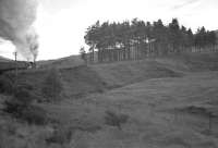 Photograph taken from the window of a coach located towards the rear of the 5.10am Glasgow Queen Street - Mallaig on 5 September 1960, with locomotives 73077+44908 working hard just north of Bridge of Orchy.  [See image 39382]  <br><br>[K A Gray 05/09/1960]