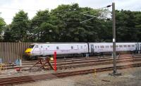 View from the window of a westbound train passing Craigentinny depot on 9 August 2013, just as an East Coast 225 set arrives in the sidings from Waverley  <br><br>[John Furnevel 09/08/2013]