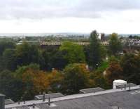 An eastbound service approximately half a mile from Airdrie station, photographed on 8 October from Monklands Hospital.<br><br>[John Steven 08/10/2013]