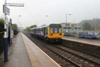 A damp and gloomy morning but Prudhoe Castle can just be seen on the hill to the south of the station. Prudhoe is now devoid of all original buildings but enjoys a regular service. 142092 calls on a Nunthorpe to Hexham service on 4th October 2013.<br><br>[Mark Bartlett 04/10/2013]