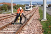 The points just east of Edinburgh Park tram stop being set for reversal during trials on 8 October 2013 before heading back to Gogar depot.<br><br>[Bill Roberton 08/10/2013]