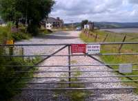 Looking north west towards Arnside signal box and the Kent estuary in July 2013. Here is the junction between the current Cumbrian Coast line and the former line to Hincaster. The builders of these lines would surely have been bemused to know that in the distant future, the only vehicle passing towards Hincaster would have been a personal horseless carriage belonging to the signalman.<br><br>[Ken Strachan 29/07/2013]