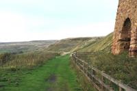 Scene high on the North Yorkshire moors at Rosedale in October 2013 showing the trackbed and kilns associated with the iron ore workings that once dominated the area. The freight only route from Battersby closed in 1929.<br><br>[Peter Todd 06/10/2013]