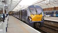 The driver has just boarded 334025 at Helensburgh Central platform 1 on 12 October as he prepares for departure with the 17.40 service to Edinburgh Waverley.<br><br>[Andrew Wilson 12/10/2013]