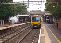 A Northern Class 323 has recently arrived at its destination at Alderley Edge with a service from Manchester Piccadilly on 3 October 2013. The emu is now heading for the down siding.<br><br>[John McIntyre 03/10/2013]