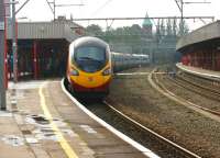 A Manchester Piccadilly - London Euston Pendolino calls at Stockport on 3 October 2013.<br><br>[John McIntyre 03/10/2013]