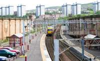 A mid-morning Gourock - Glasgow Central service leaves platform 1 of Greenock Central on 29 July 2005. Note the surviving supporting walls from the original overall roof, complete with castellated turrets at the east end [see image 21301]. The old bay platform is to the left.<br><br>[John Furnevel 29/07/2005]